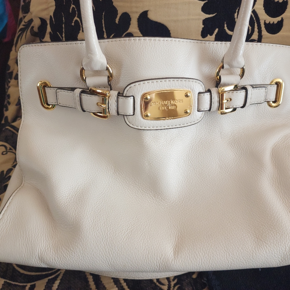 Michael Kors purse with matching wallet.